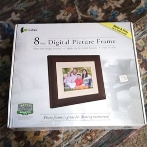 New 8 in digital frame still in box cord with stand the brand is Giinii